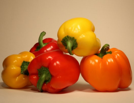 Red, yellow, and orange peppers.