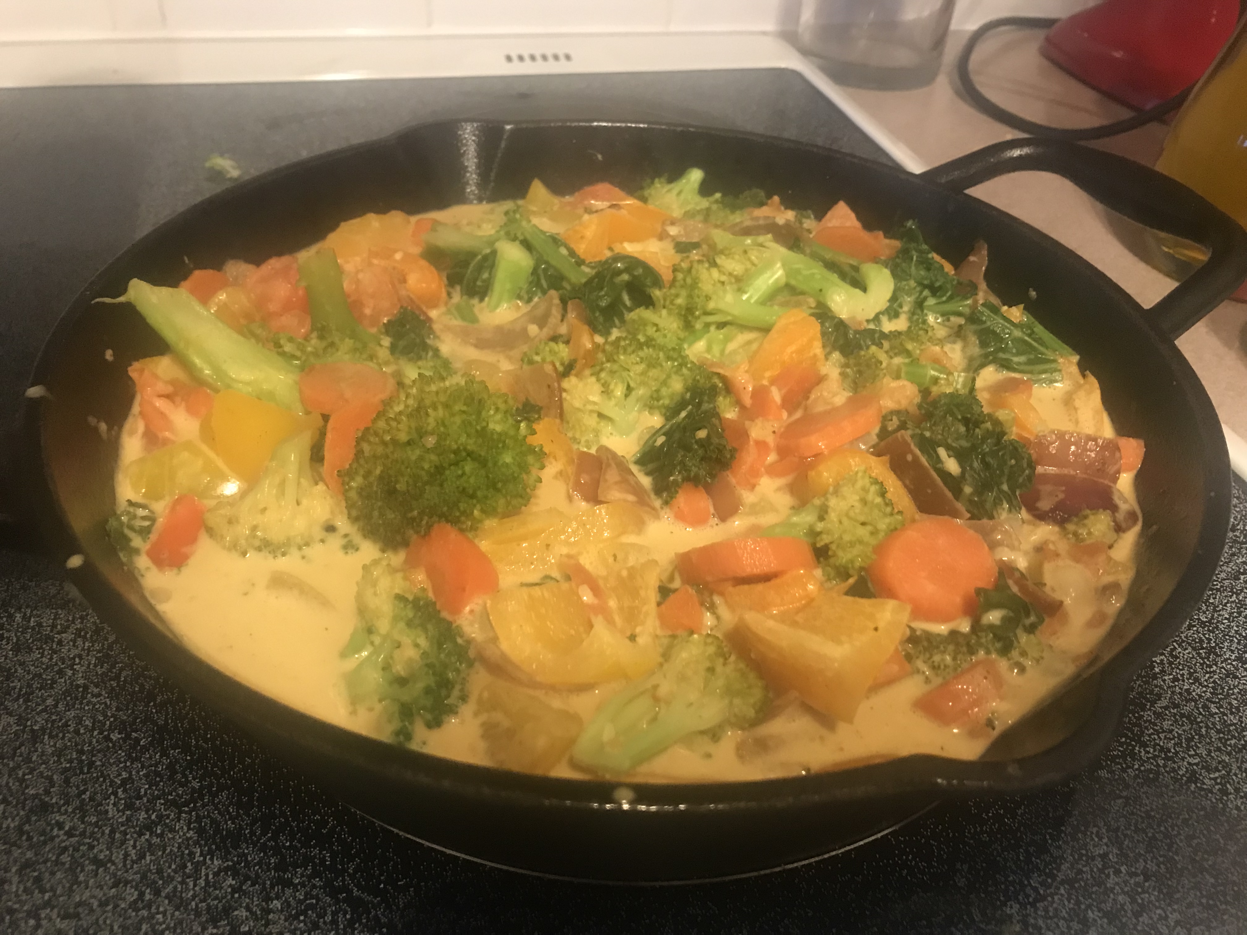 mild coconut curry sauce in a frying pan