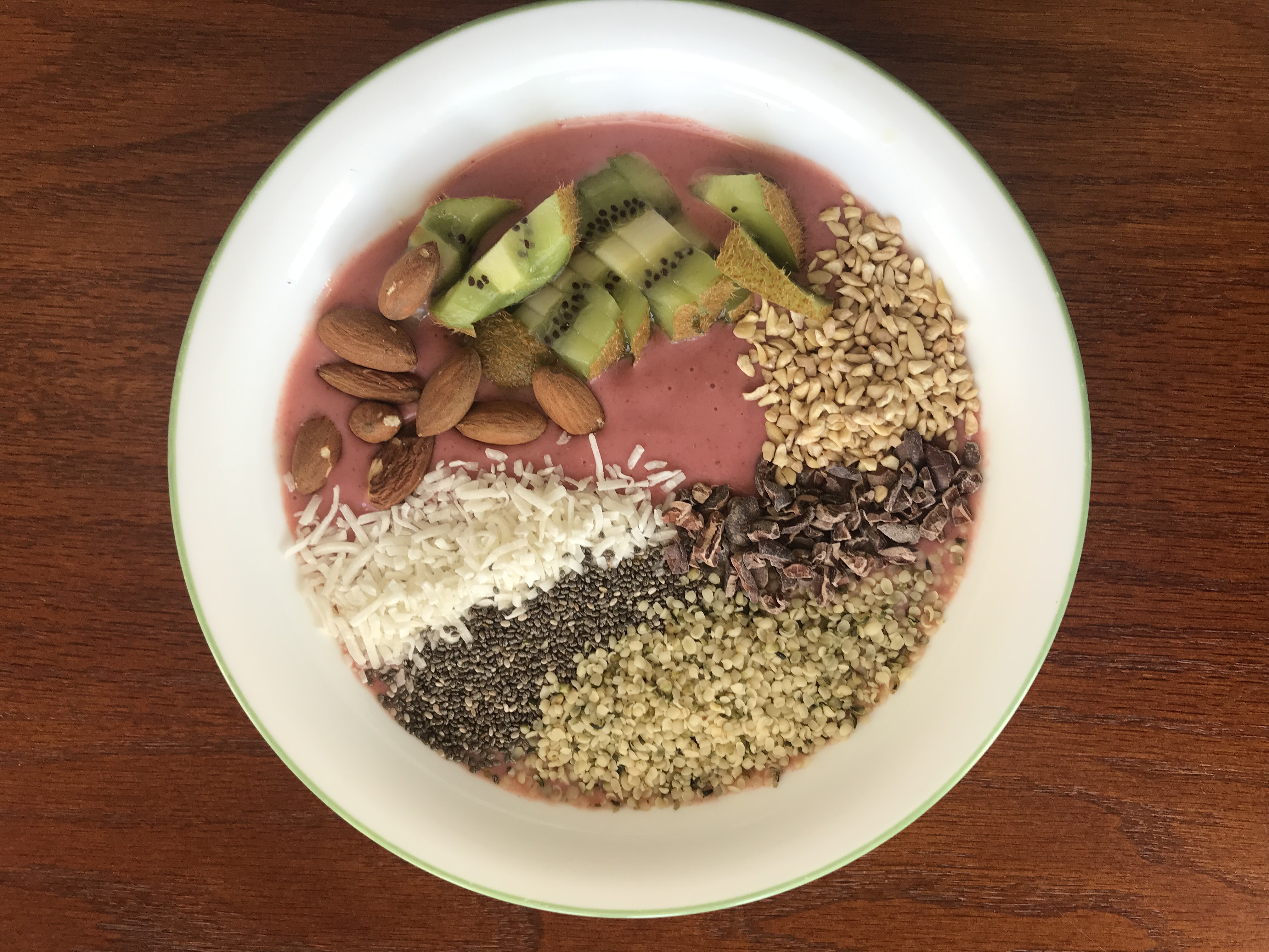 smoothie bowl with seeds, nuts, and fruit