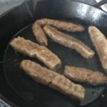 vegan sausages in frying pan