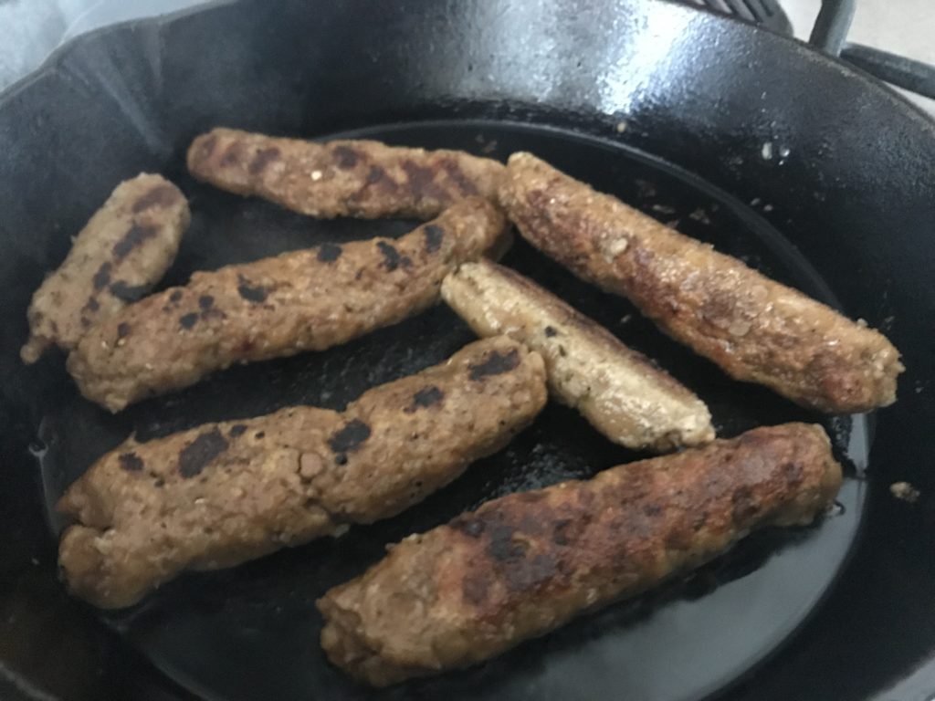 vegan sausages in frying pan