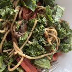 spaghetti with spices, tomatoes, and kale