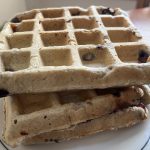 close up angle view of 3 waffles on a plate